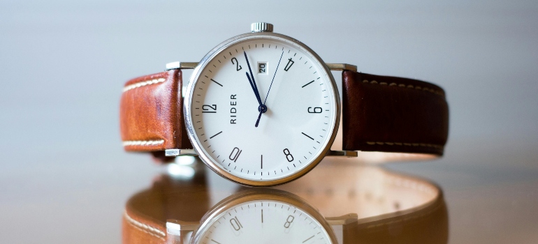 Close-up of a stylish wristwatch—reminding movers that timing is key during relocation.