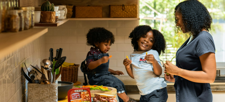 Adult and children in the kitchen