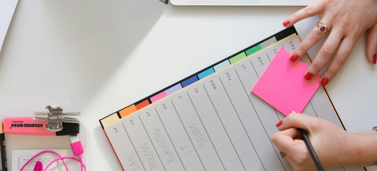 People making a schedule in order to maintain work-life balance after moving to Calgary
