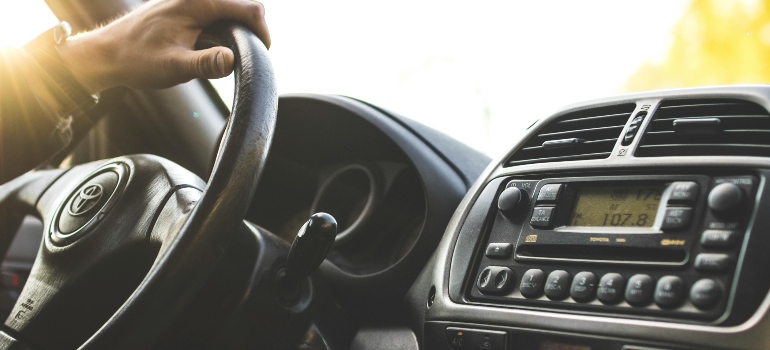 Person driving a car during their move from Etobicoke to Milton
