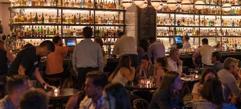 group of people gathering inside bar