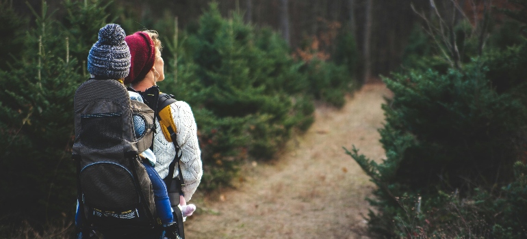 woman carrying baby on her back