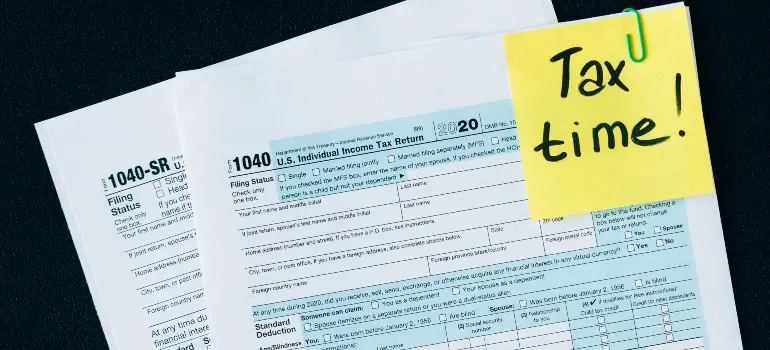Tax payment forms representing banking differences between Canada and the US, highlighting how each country handles financial reporting and regulation.