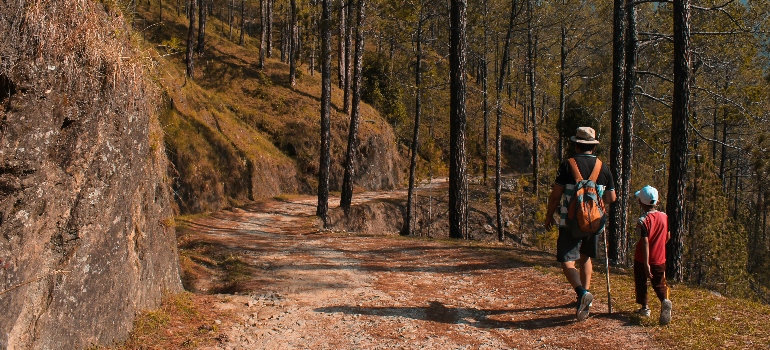 man and kid walking on downhill