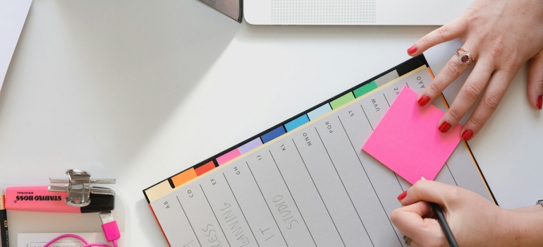 Person making a plan for relocating your home office