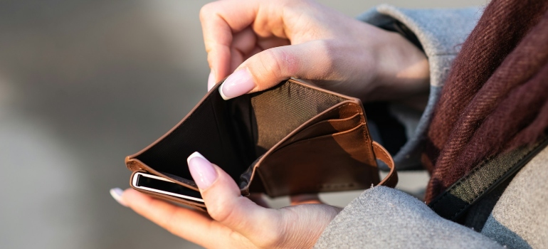 Person holding an empty wallet