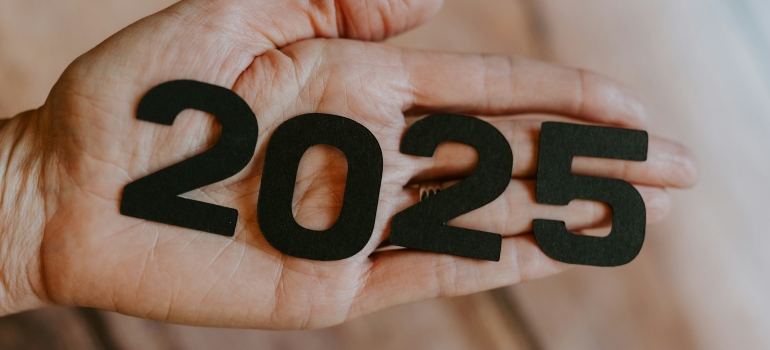 Person holding numbers on their palm