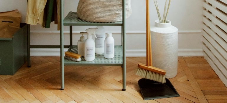 Essential cleaning tools required to relocate, including all-purpose cleaner, sponges, and a brush.