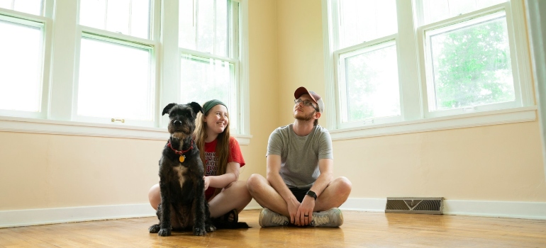 Family sitting in an empty home
