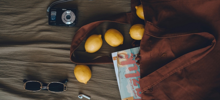 a tote bag with lemons, glasses