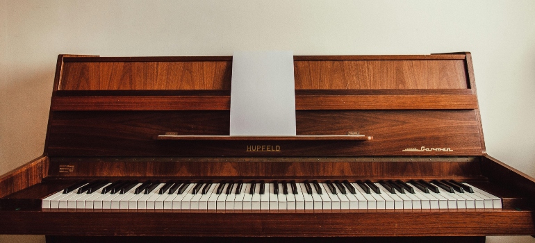A close-up picture of a wooden piano.