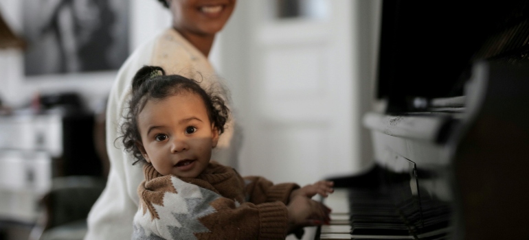 A toddler playing the piano.