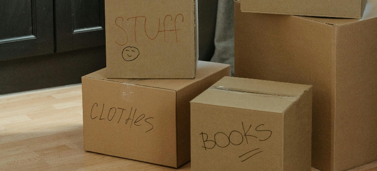 Labeled boxes in a storage unit showcasing organization pointers for storage units.