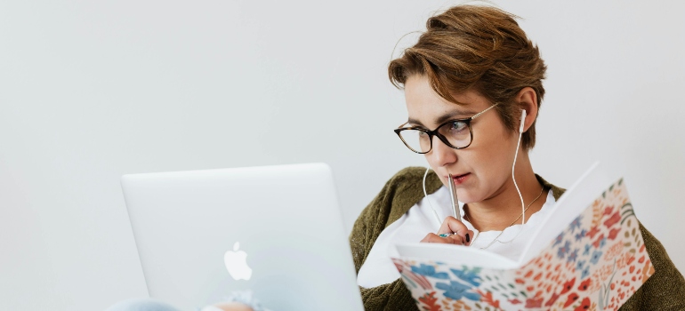 Woman researching utility providers online on her laptop.