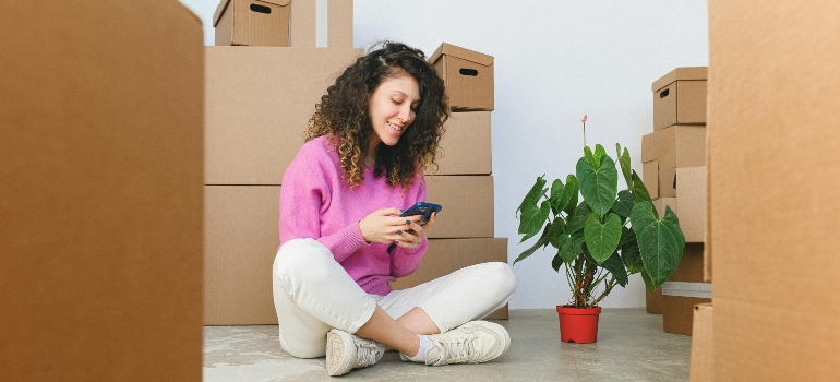 Woman checking a best way to transport plants during a relocation.