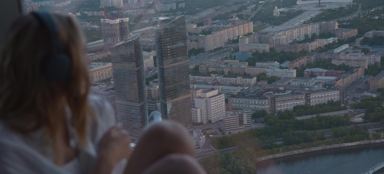 a girl looking at the city thinking about moving from Mississauga to Pickering