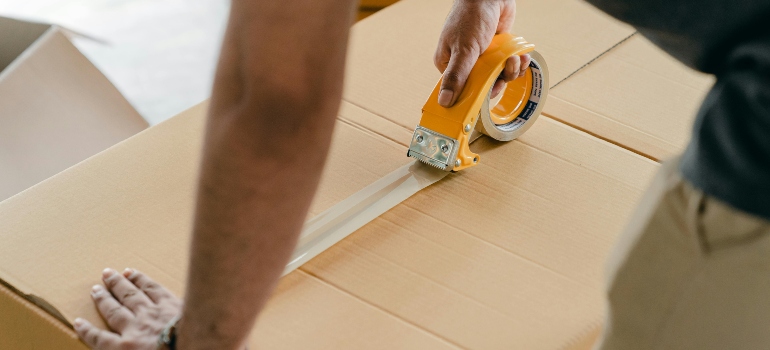 a boy stretching a box