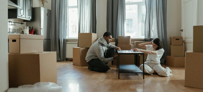 boy and girl surrounded by boxes
