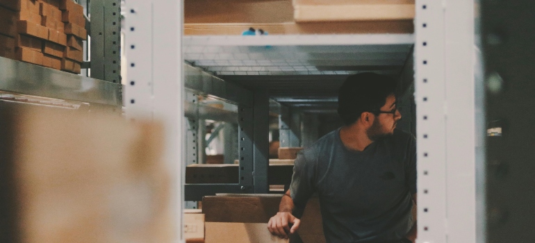 A mover inside a climate controlled storage during an office move.