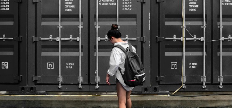 Woman accessing a storage unit after following tips on how to purge your stuff before a move