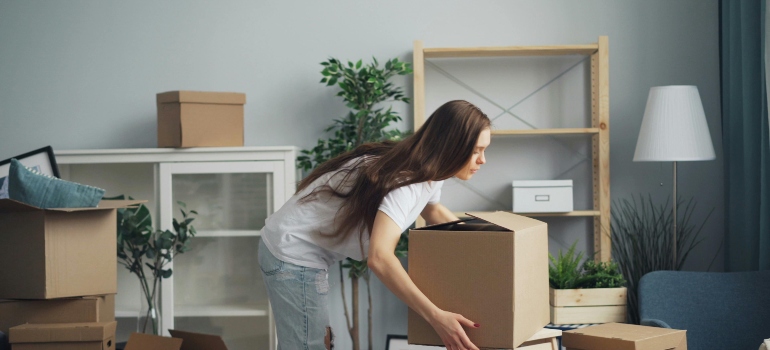 a girl holding a box