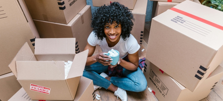 a girl packing boxes for moving from Etobicoke to Vaughan