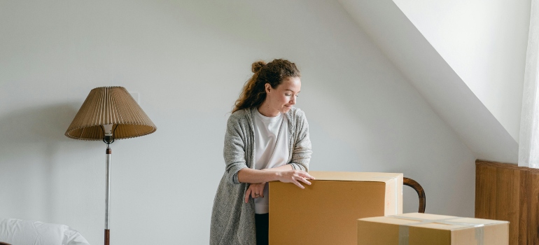 a girl packing boxes before moving from Etobicoke to Vaughan
