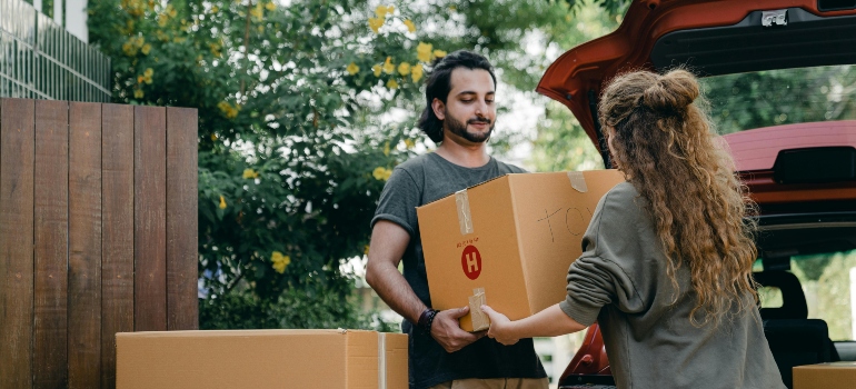 boy and girl holding the box