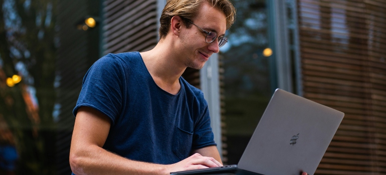 Selective Focus Photo of Man Using Laptop