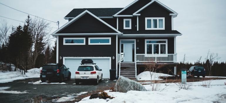 Cars parked in front of a house