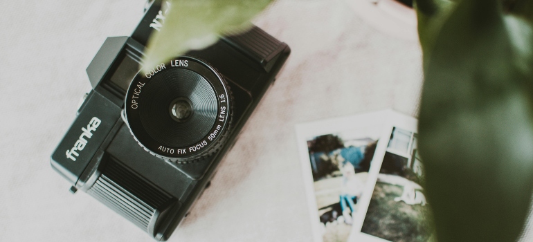 Black Franka Camera on White Textile
