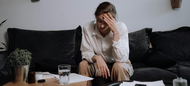 A Woman with Problems Sitting on the Sofa