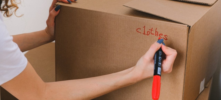 Person labeling a box