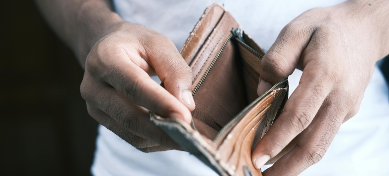 a man holding an empty wallet