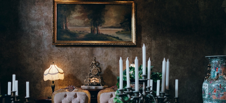 Vintage dining room with framed painting and decorative furniture at risk as commonly damaged articles during relocation.