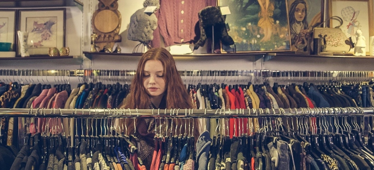 Photo of Woman Near Clothes adapting to new climate after relocation